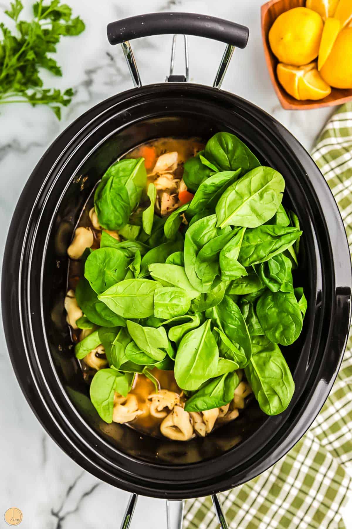 fresh spinach in a slow cooker