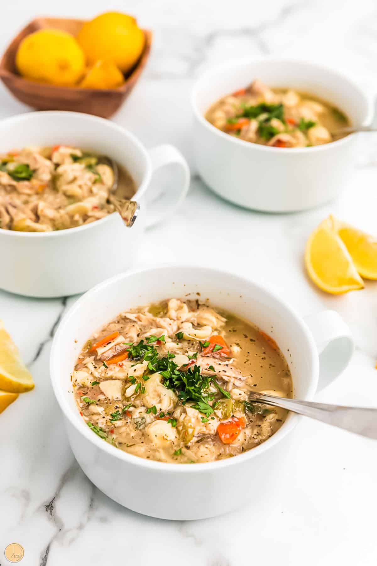 chicken tortellini soup in bowls