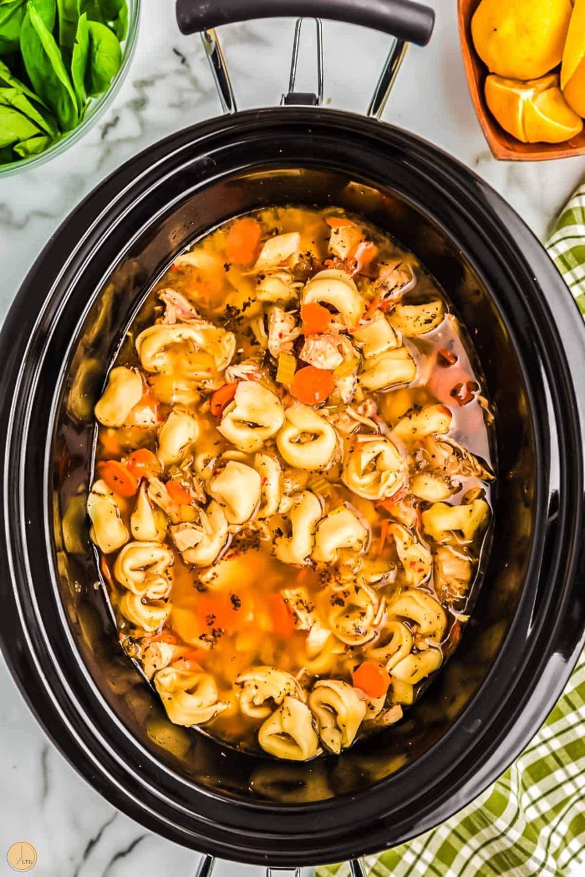 tortellini soup cooking in a crockpot
