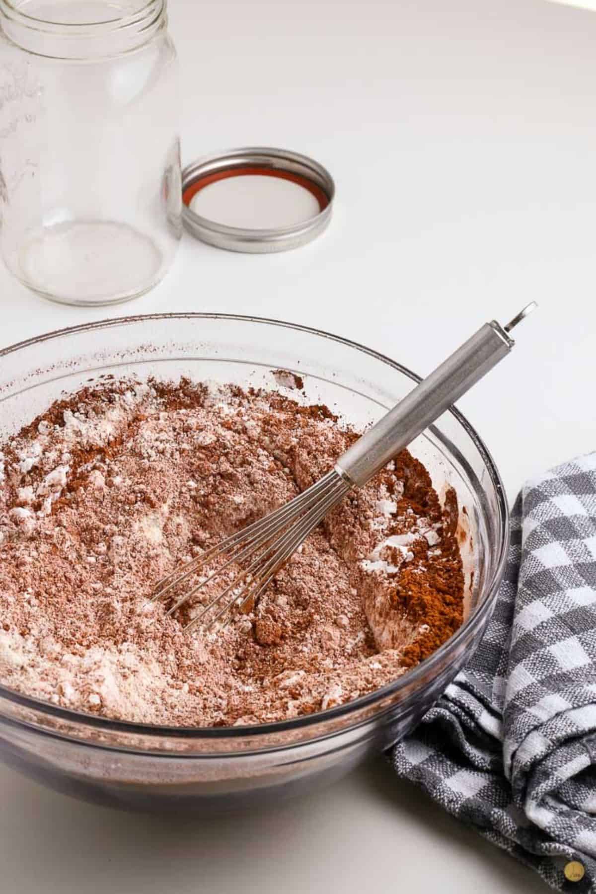 DIY hot cocoa mix being swirled together with a whisk