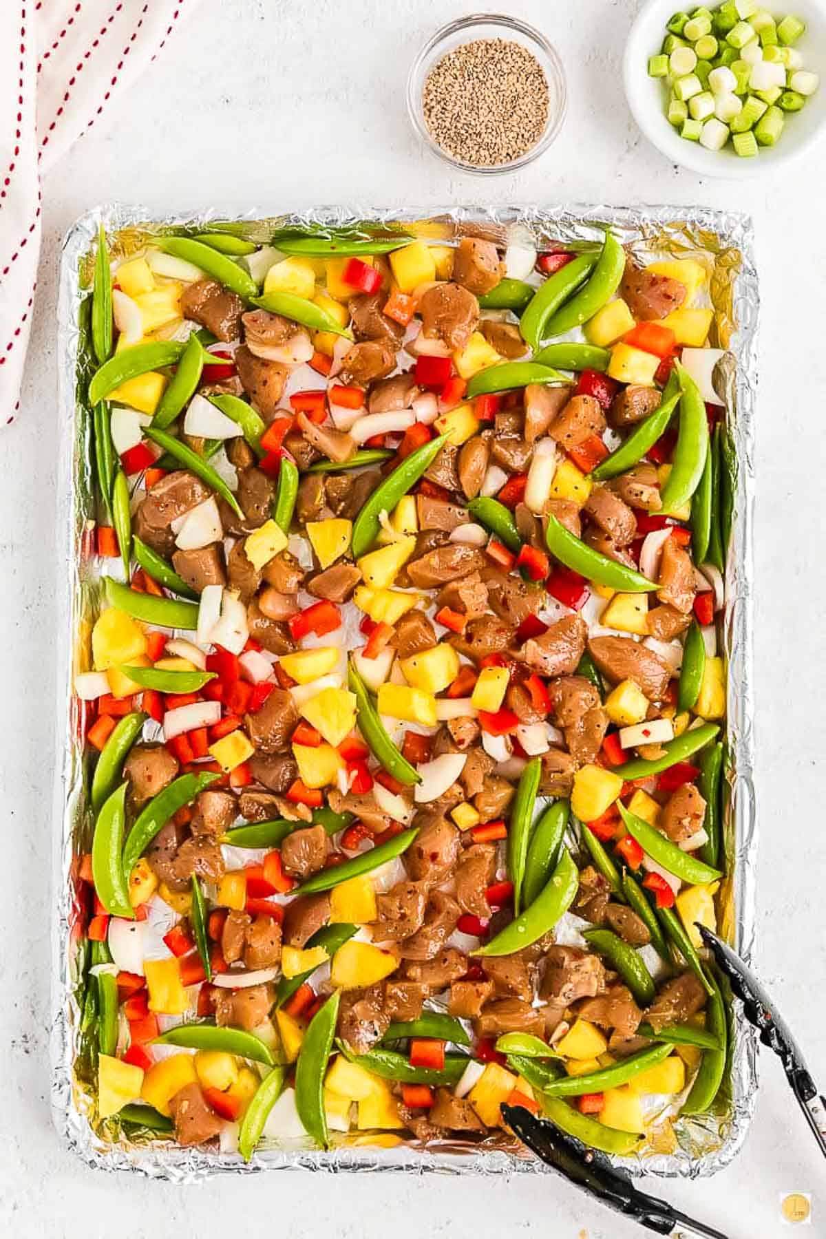 chicken and veggies on a sheet pan