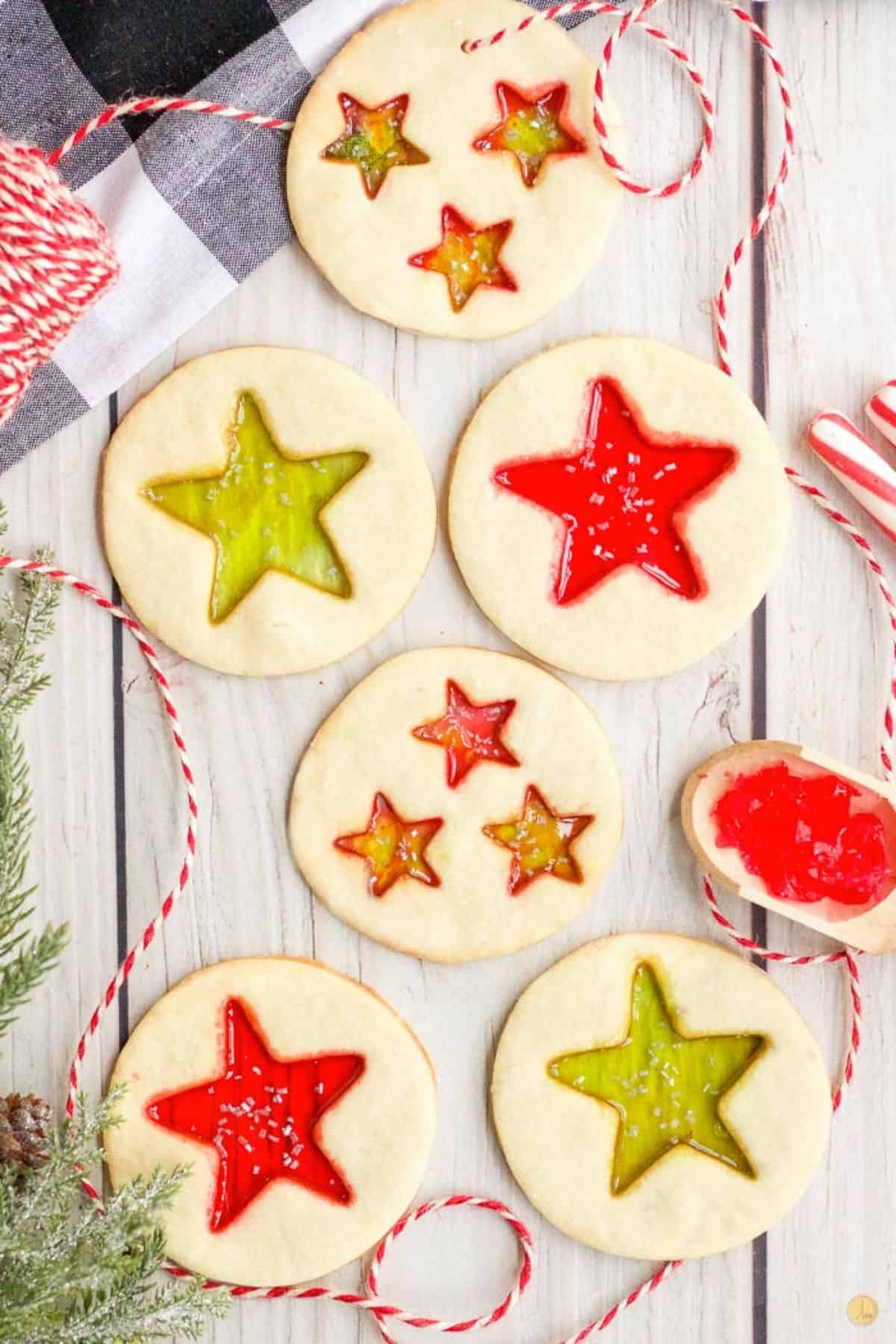 stained glass cookies on a wood board