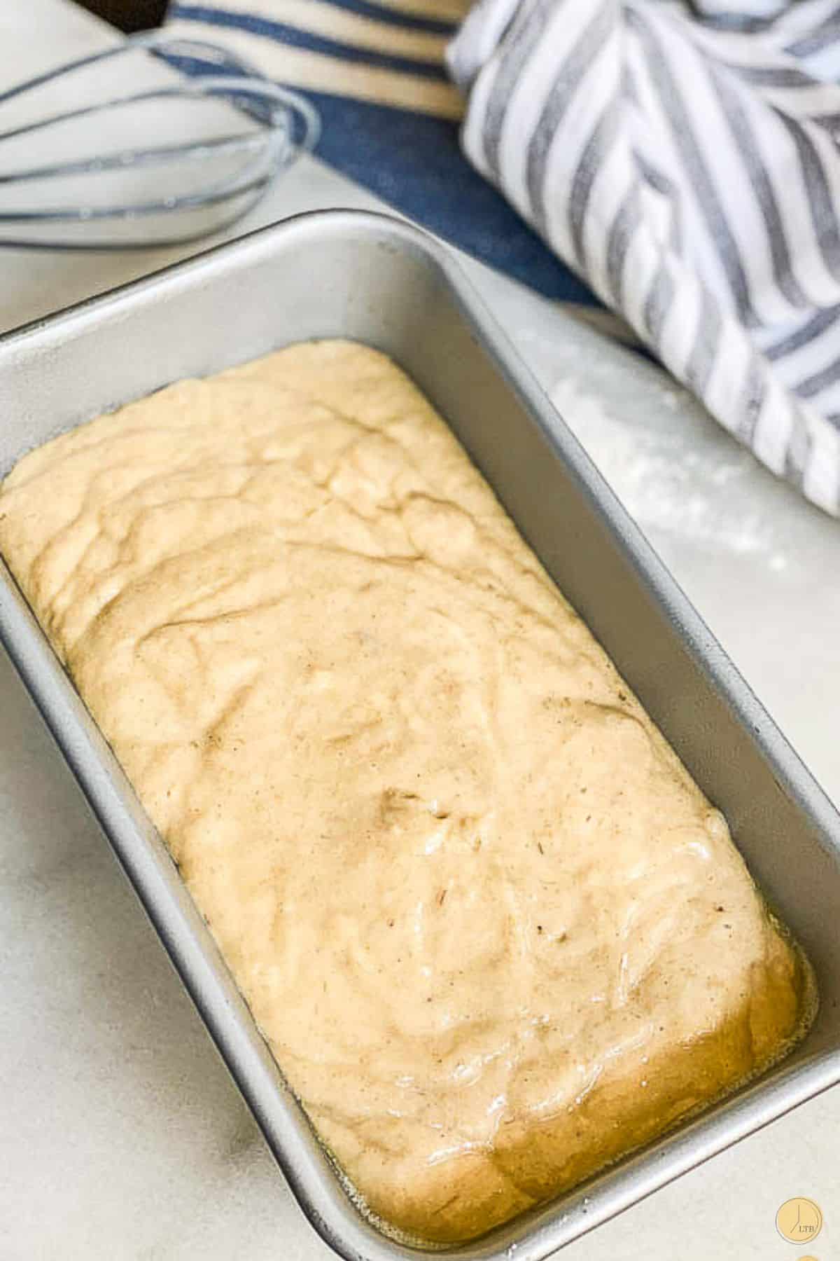 batter pouring in a loaf pan