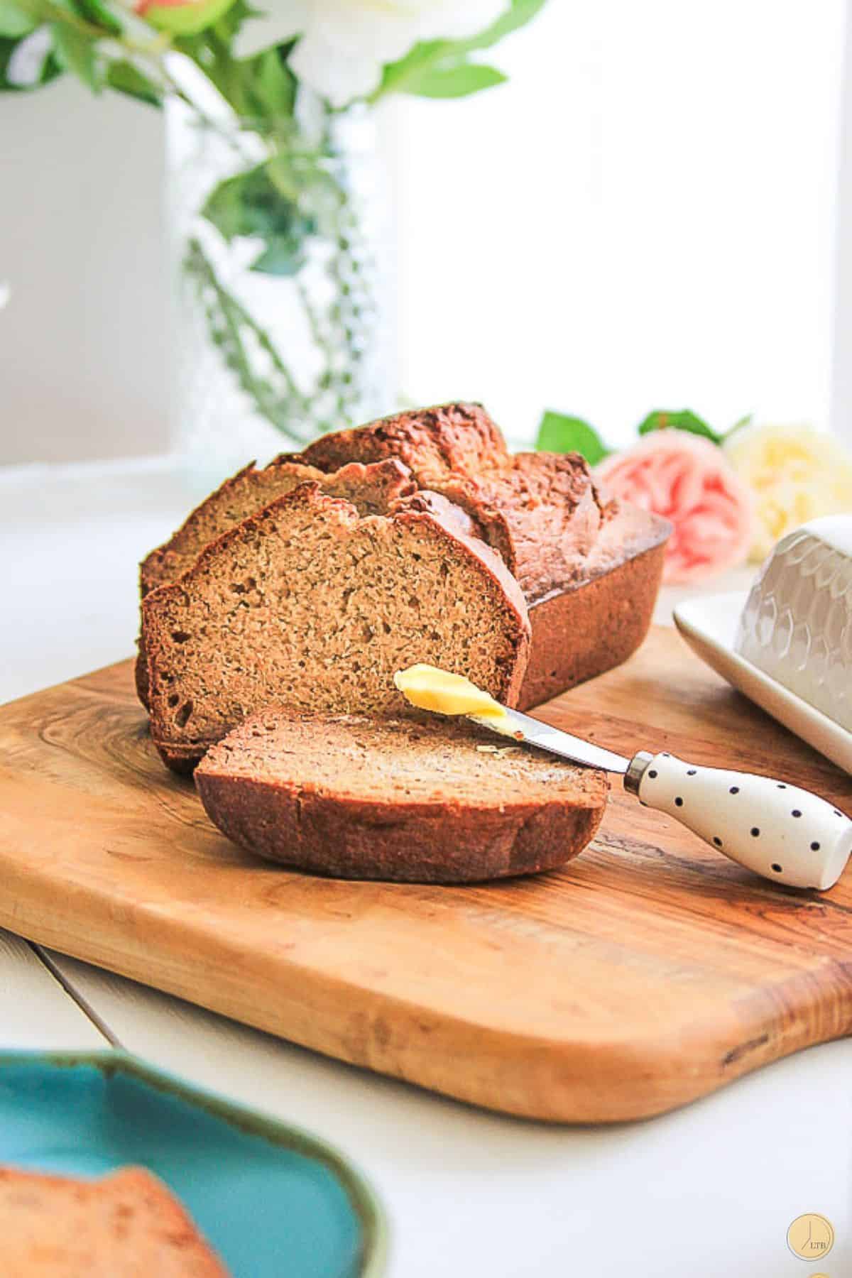 brown sugar banana bread slices on a wood board