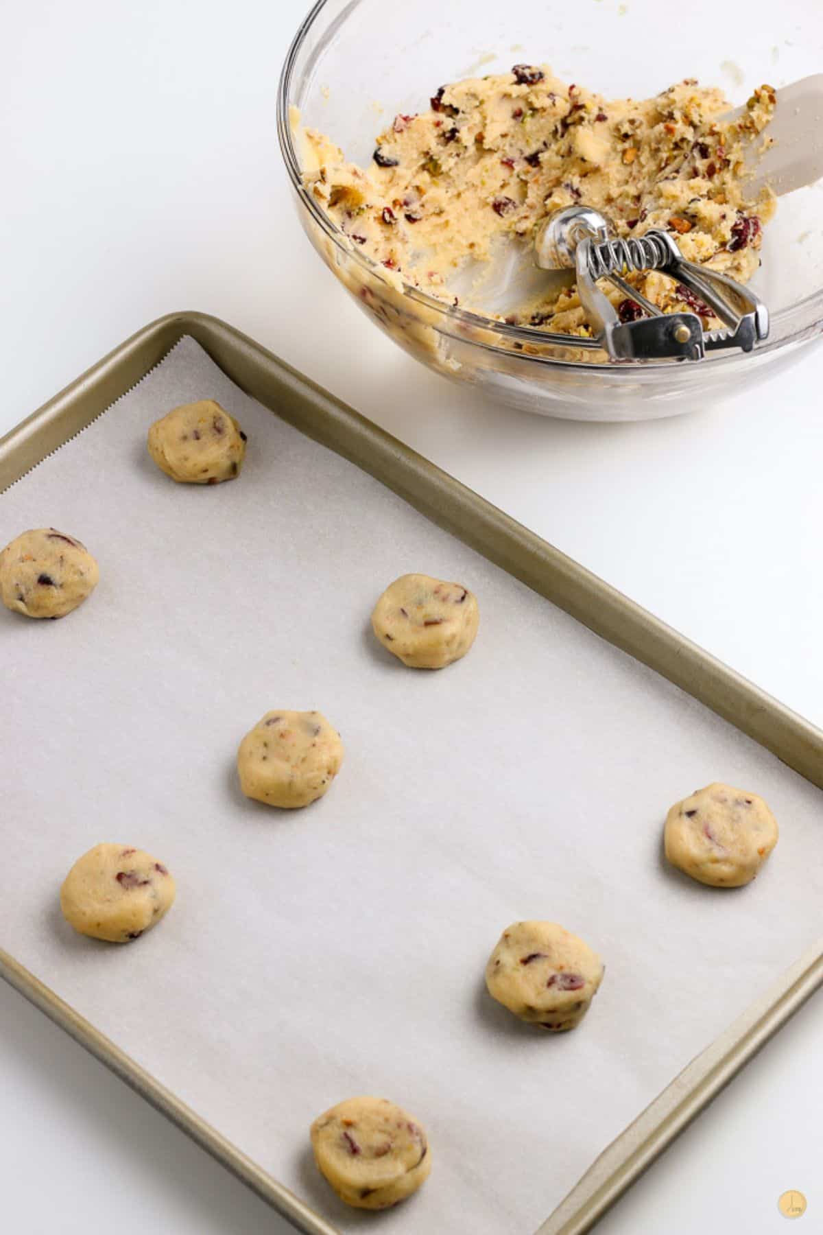 unbaked cookies on a parchment paper