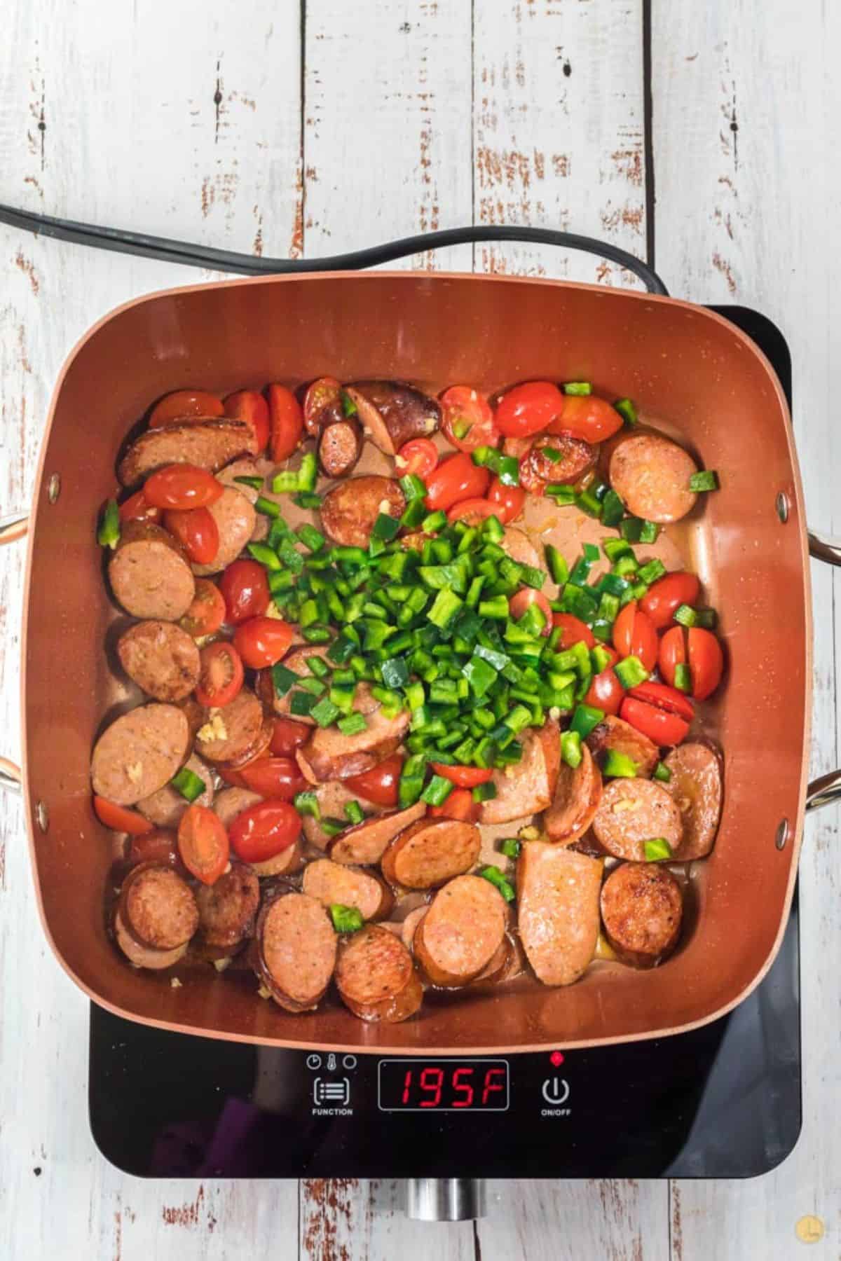 sausage and tomatoes in a skillet