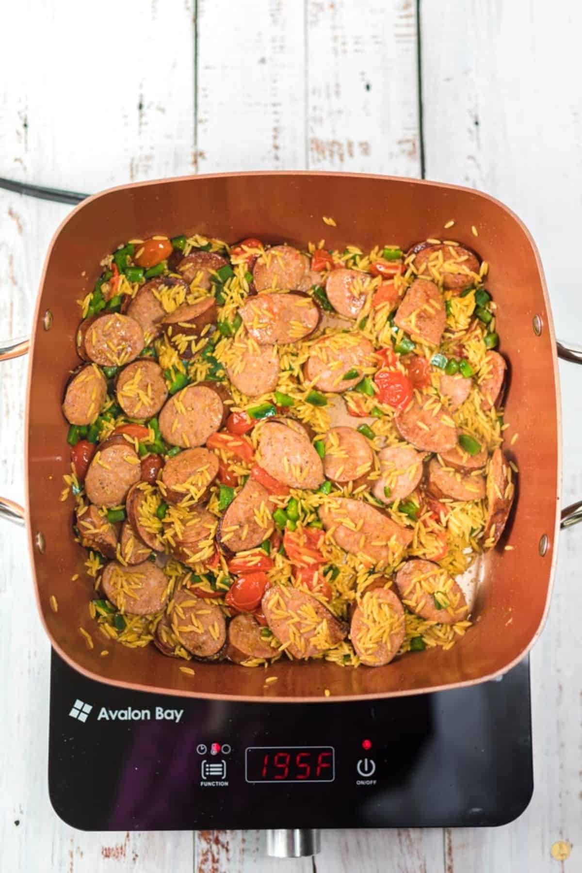 unbaked cajun sausage in a skillet