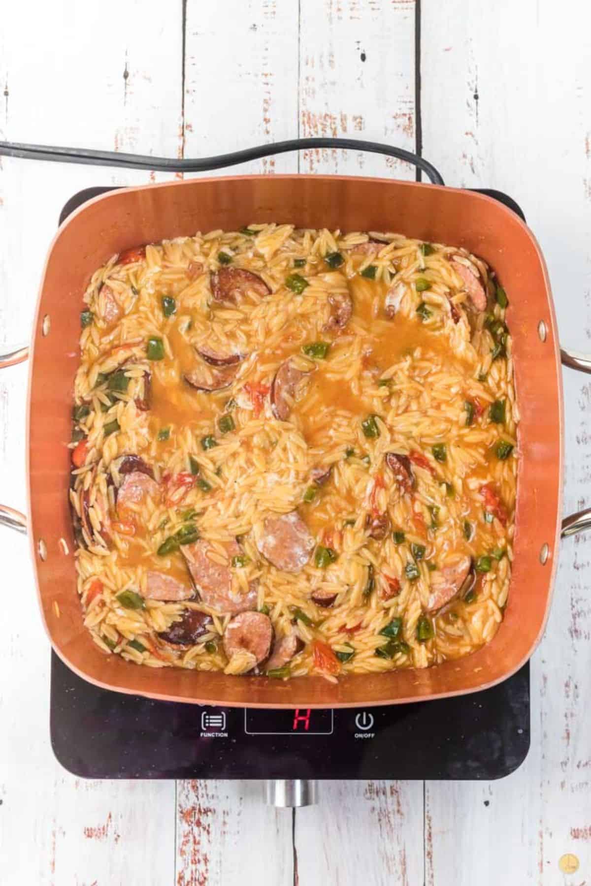 skillet with sausage and orzo