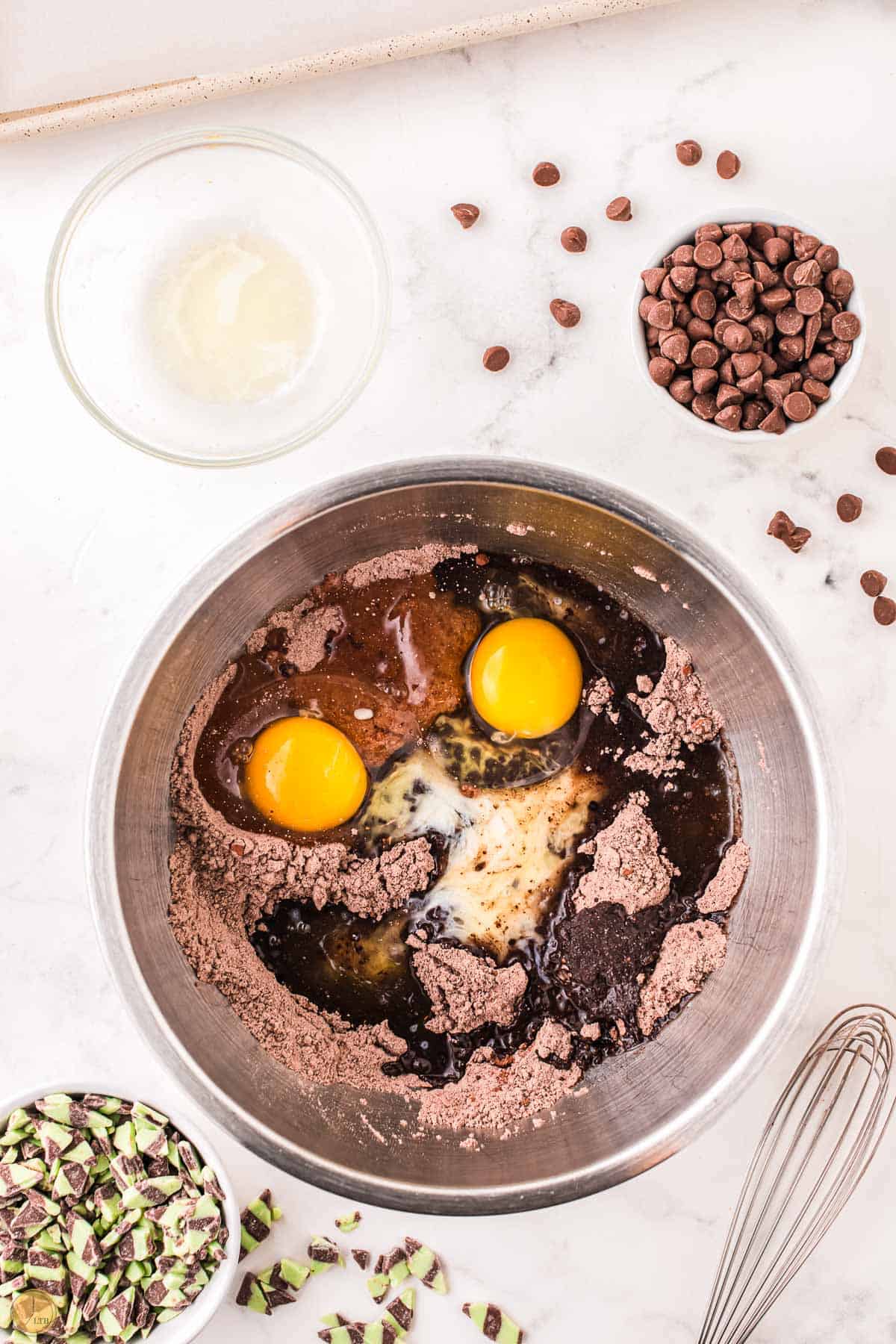 cake mix and eggs in a metal bowl