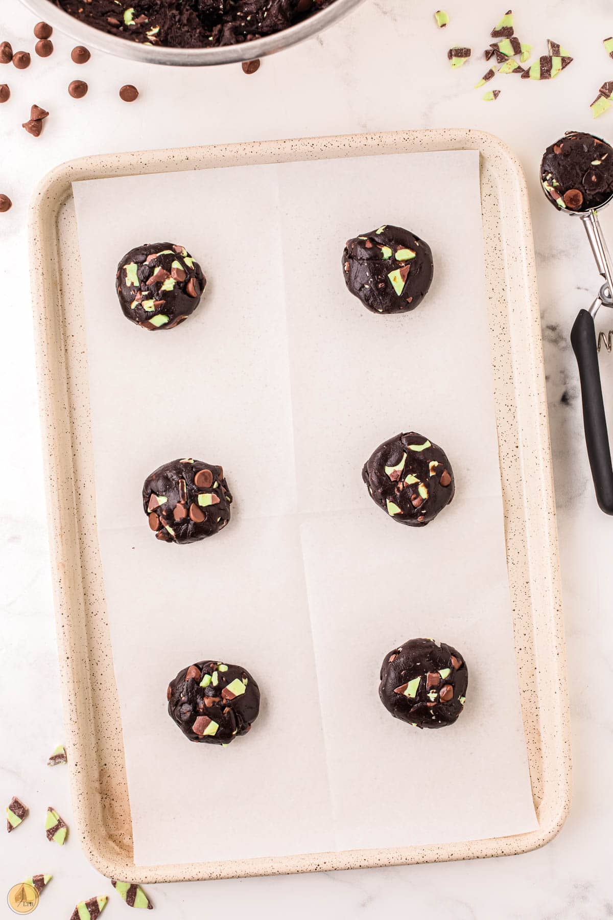 unbaked cookie dough on a cookie sheet