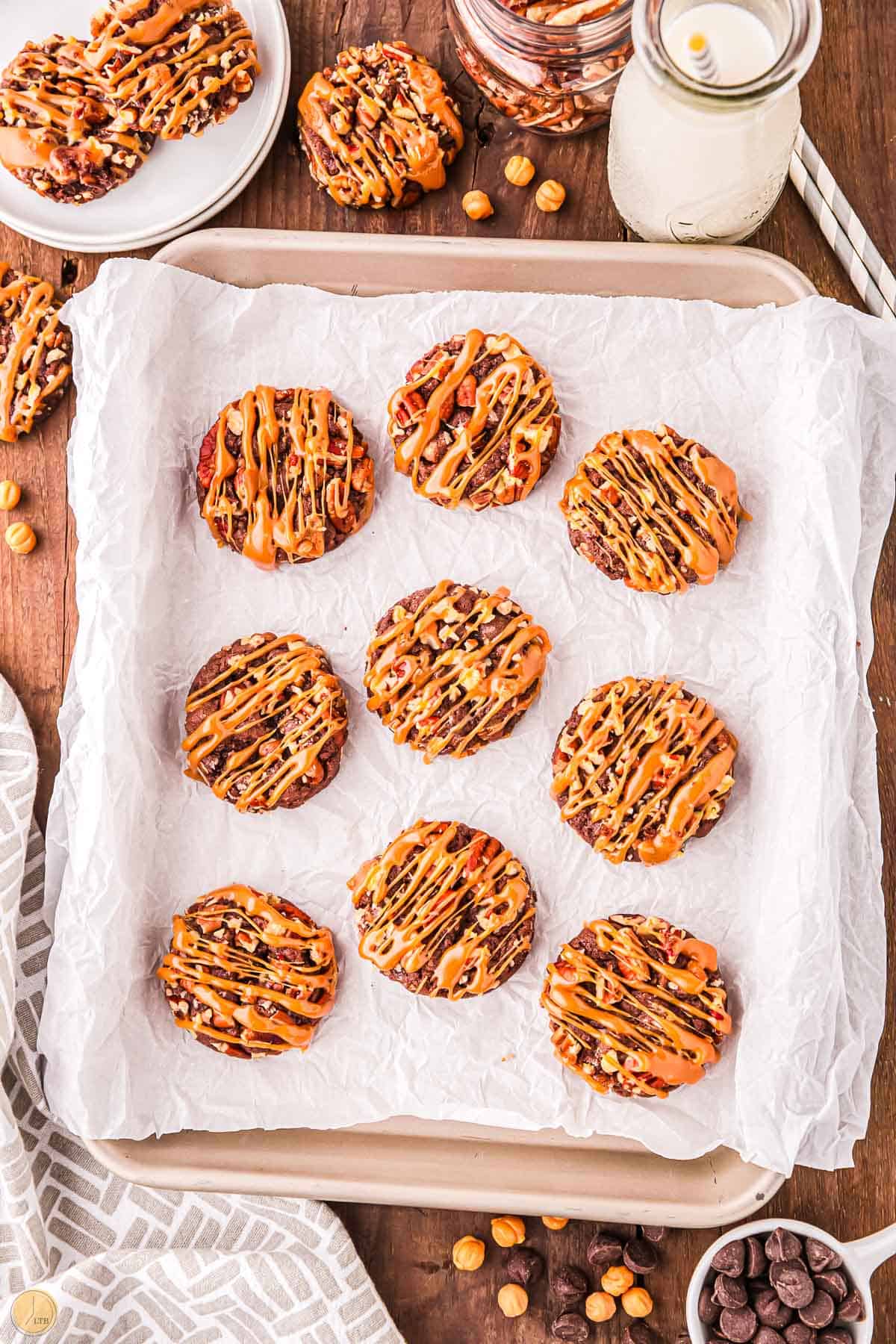 baking sheet with 6 turtle cookies on parchment paper