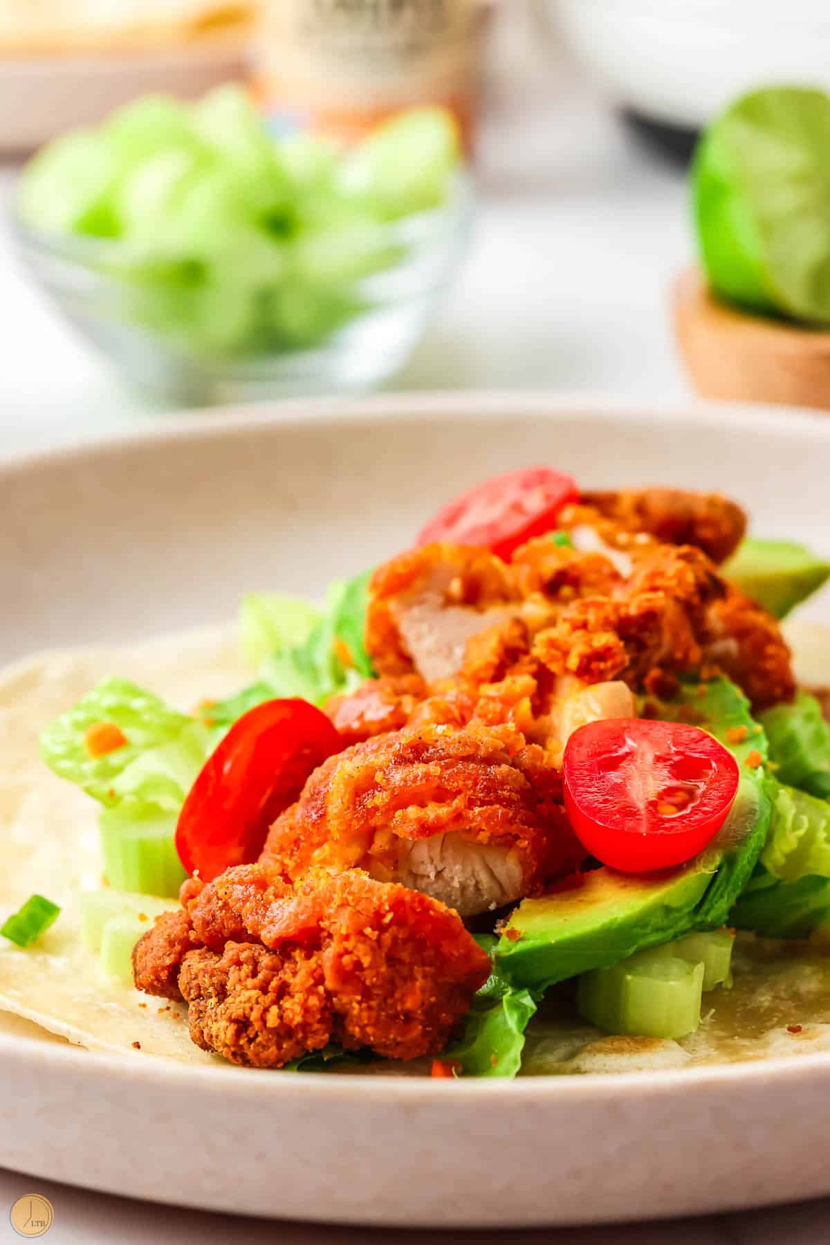 open wrap with chicken with lettuce and tomato