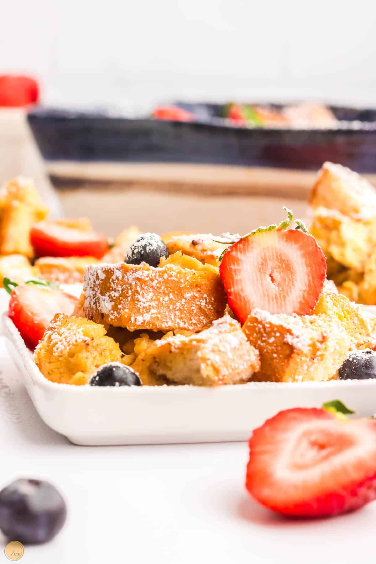 french toast bake on a plate with strawberries