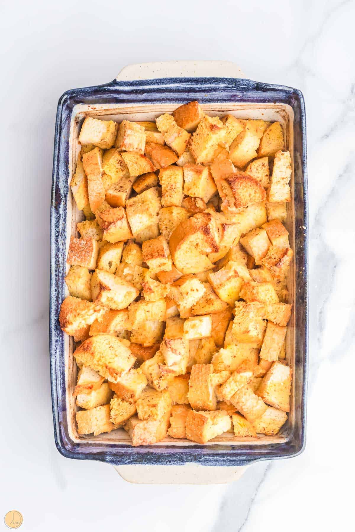 baked bread casserole in a blue dish