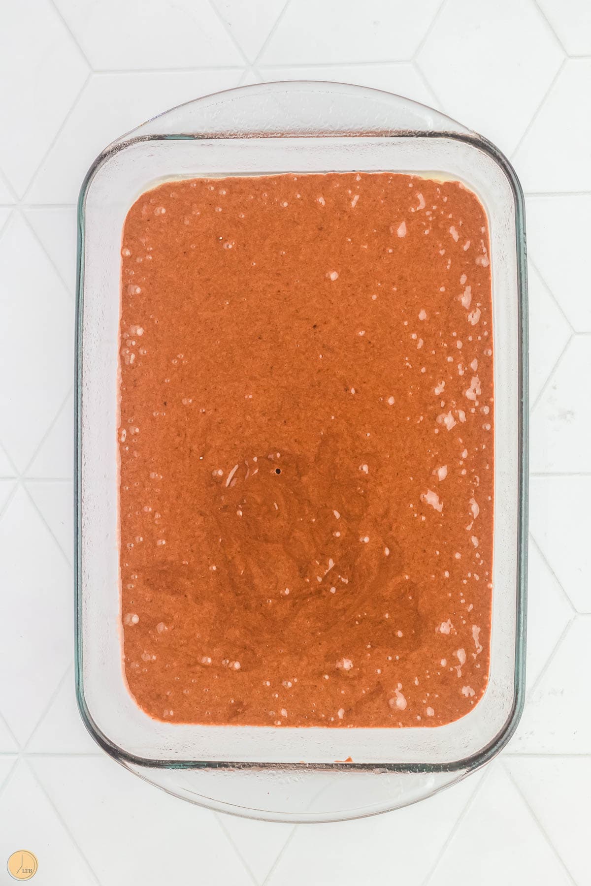 uncooked cake batter in a clear dish