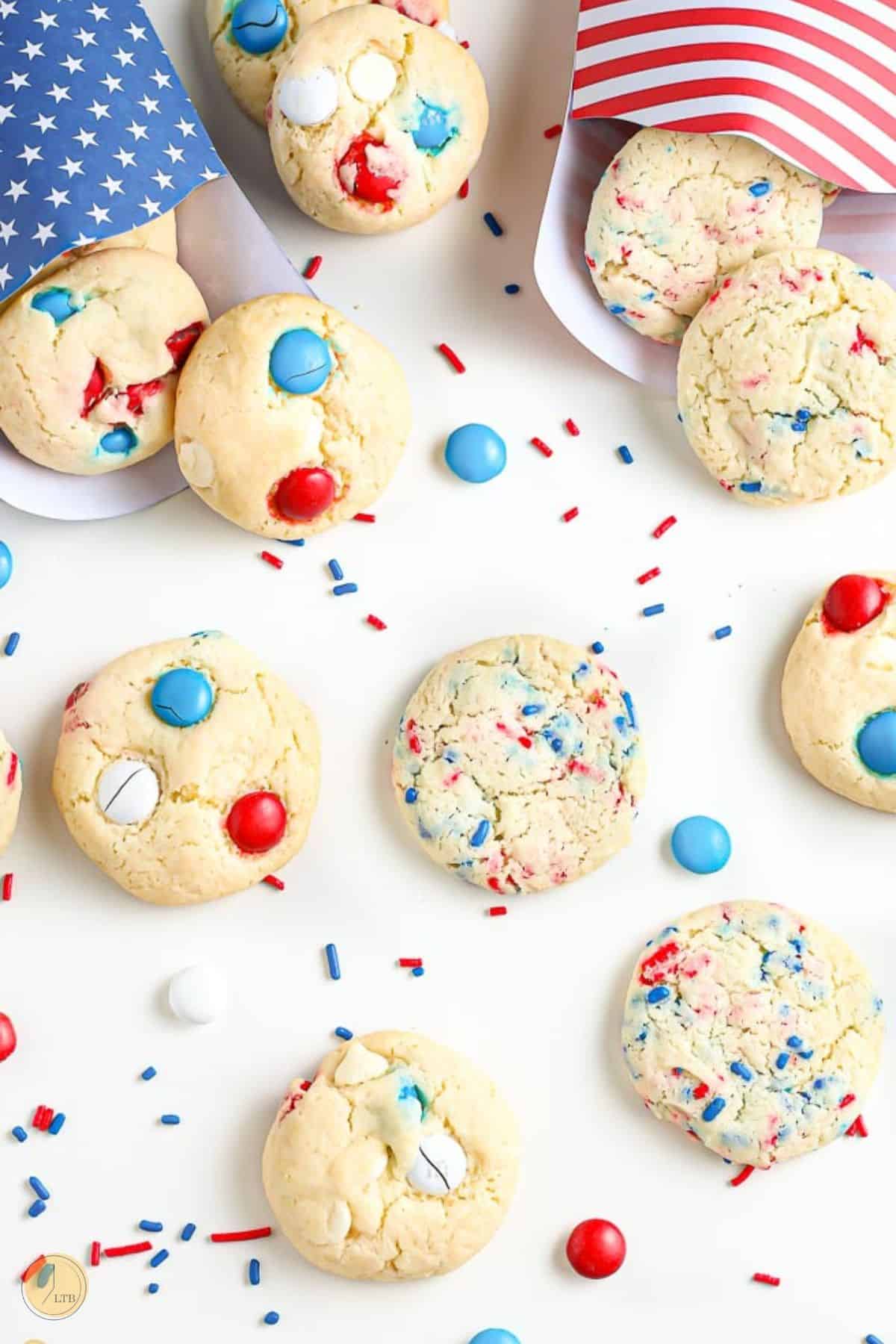 baking sheet with cookies on it and some colored envelopes