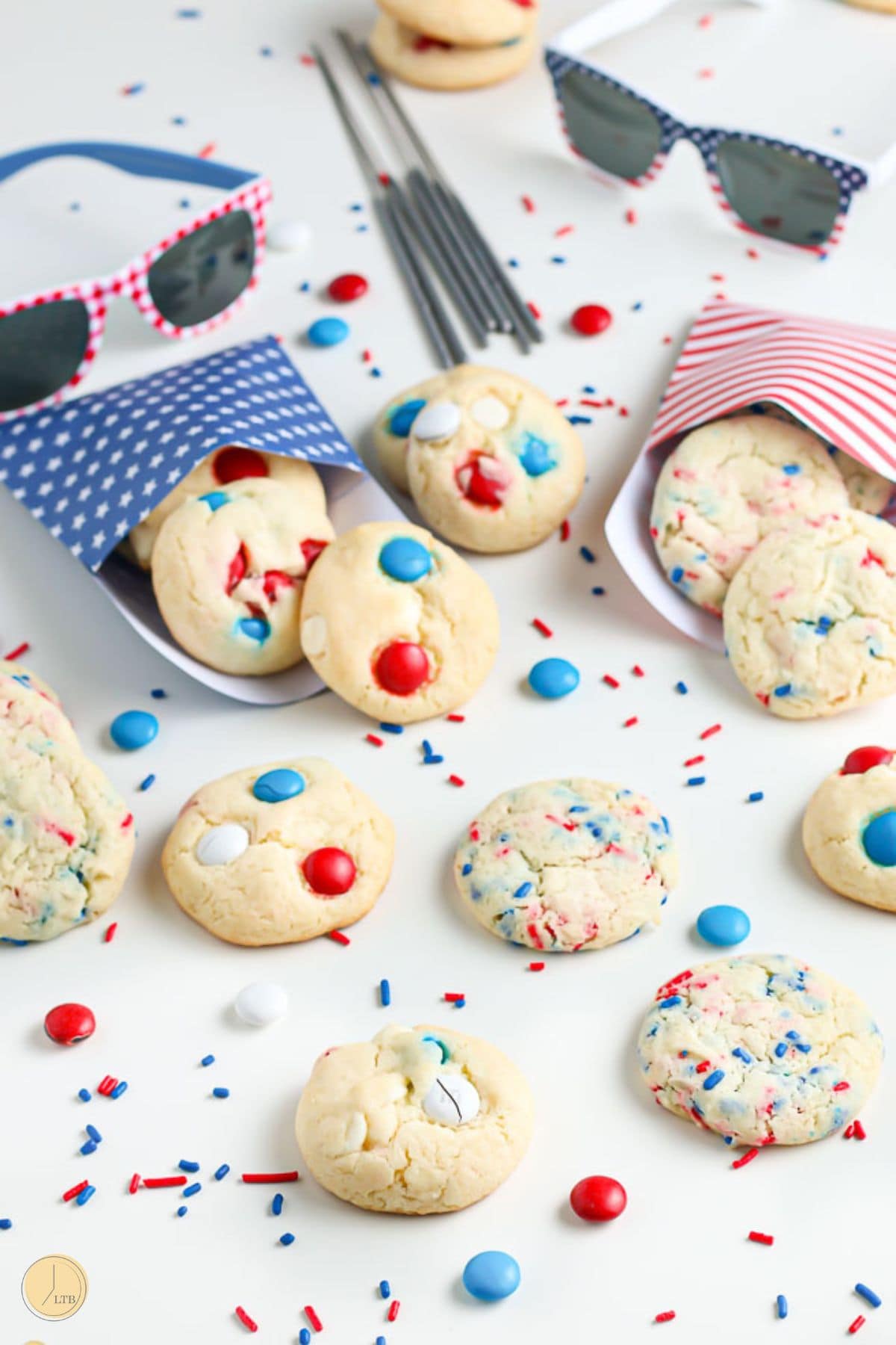 cookies on a counter with two pair of sunglasses
