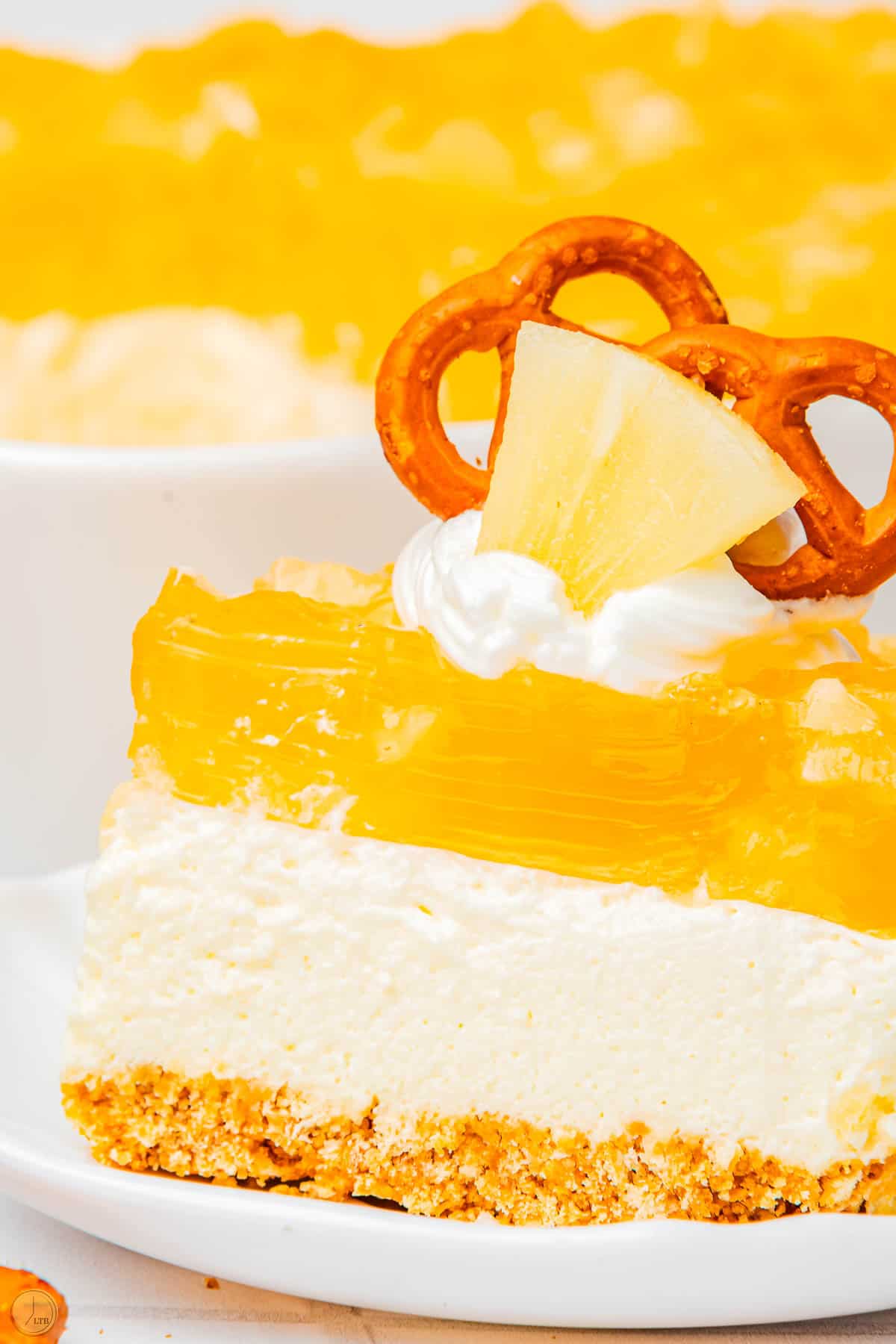 close up of side view of a layered jello salad with pineapple