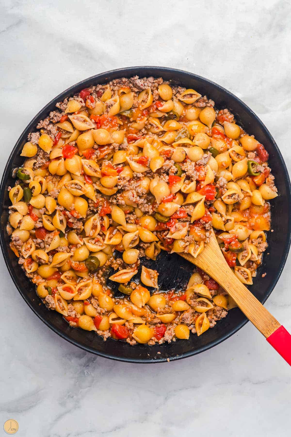 meat and pasta in a pan