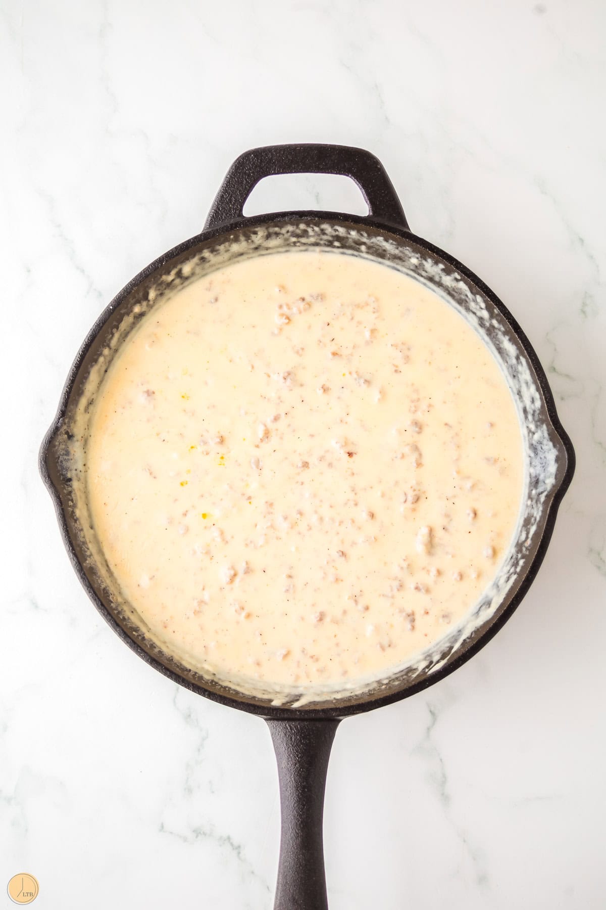 sausage gravy in a cast iron skillet